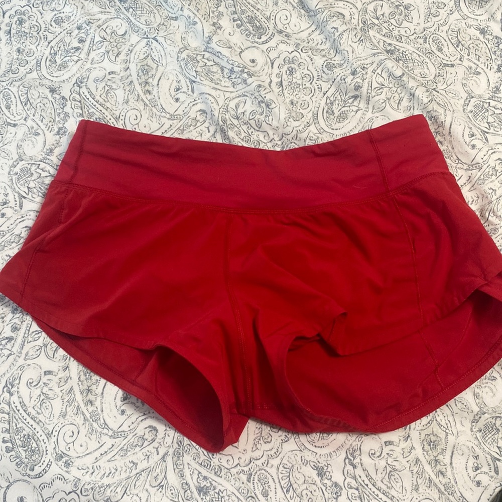 lululemon shorts in very good condition !! color is red and 2.5 inch speed ups!!